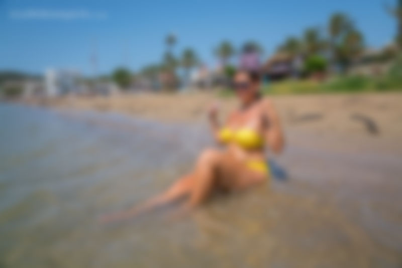 Yellow Bikini On The Beach