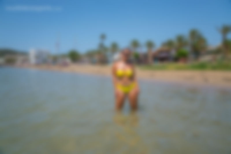 Yellow Bikini On The Beach